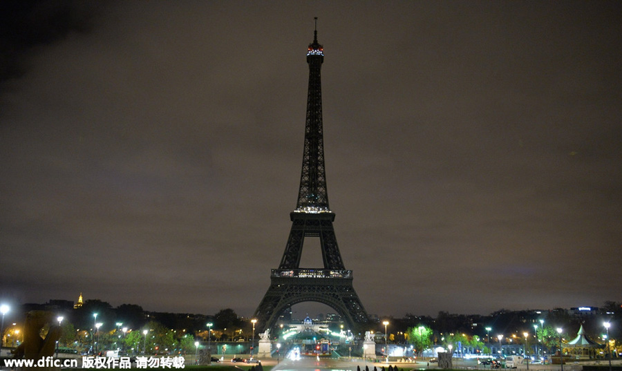 Eiffel Tower goes dark as France mourns terrorist attack victims