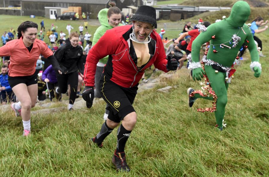 Brave competitors swamp in Christmas mud run