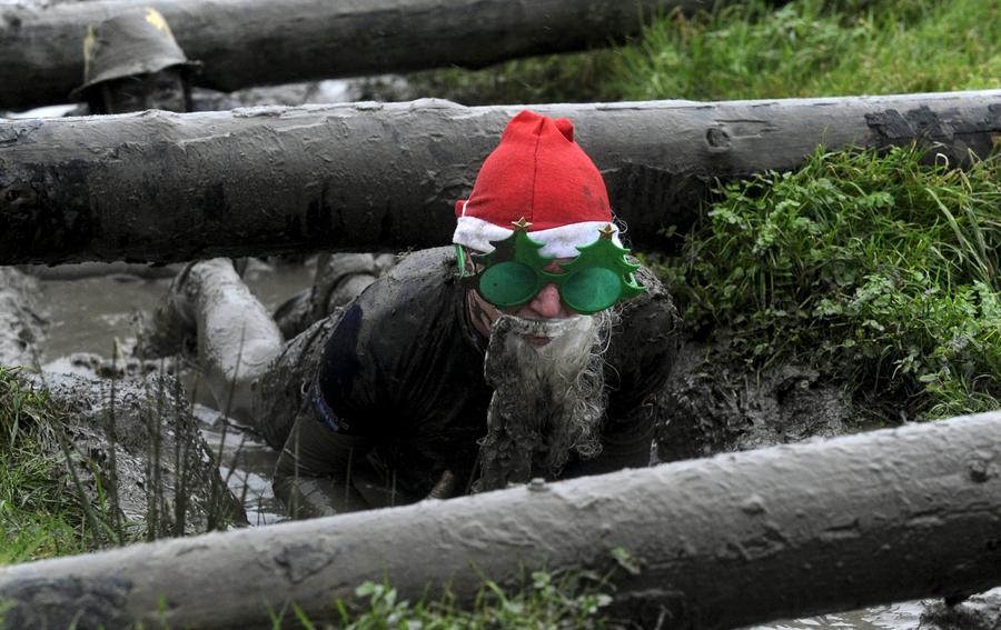 Brave competitors swamp in Christmas mud run