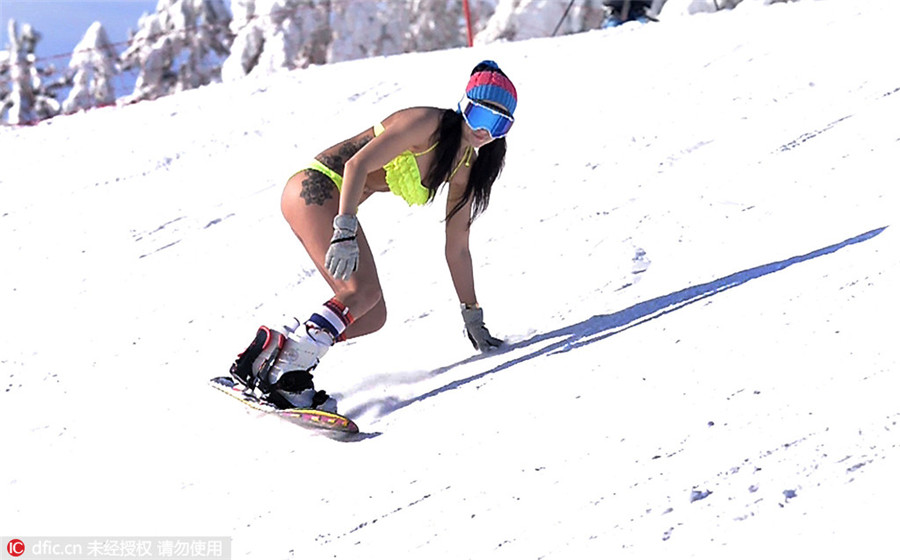 Bikini-clad Russian babes hit ski slopes
