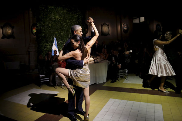 Obama dances tango during a state dinner in Argentina