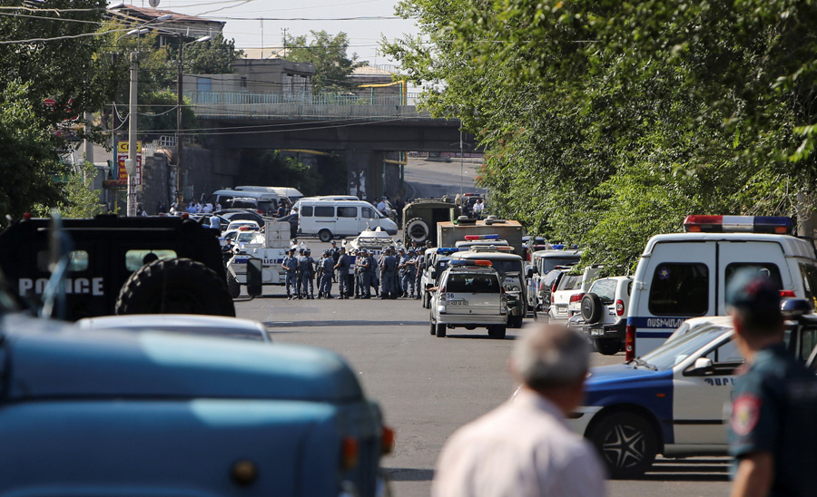 Armed men in Armenia seize police station, demand politicians' release