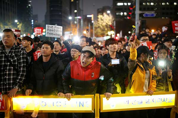 S. Korean prosecutors see scandal-hit president as criminal suspect