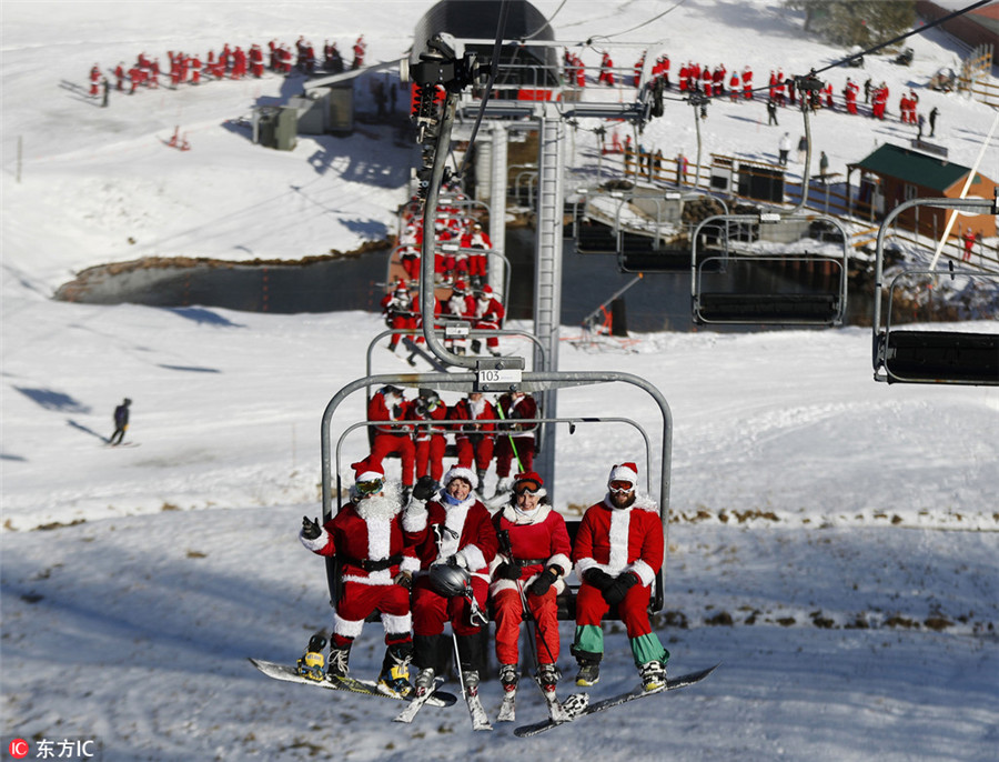 Santas ski for charity fund-raising in US