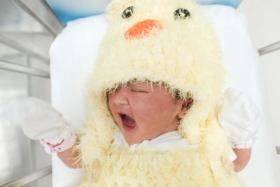 Newborn babies in Bangkok ring in CNY with chicken costumes