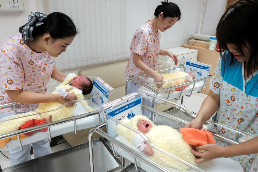 Newborn babies in Bangkok ring in CNY with chicken costumes