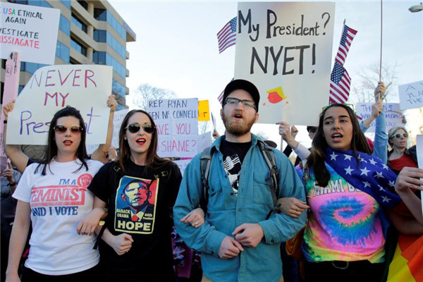 Thousands of demonstrators across US say 'Not My President'