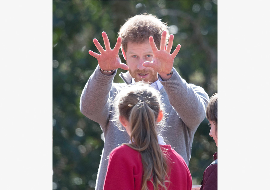 Prince Harry helps students grow 'Queen's canopy'