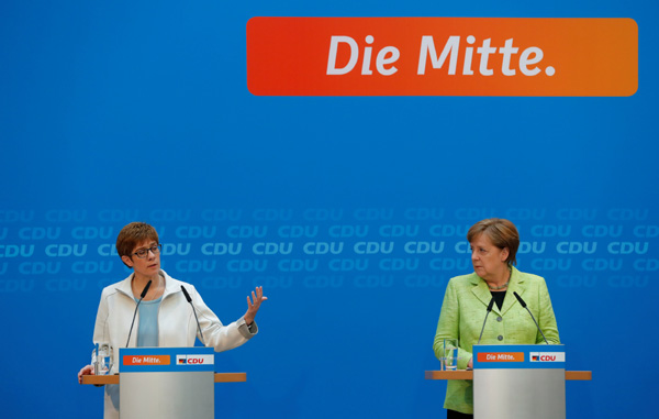 Merkel's sweeping victory in state election dims 'Schultz effect'