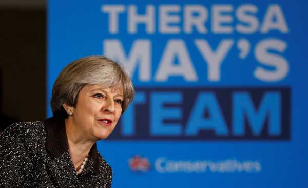 Bins, cooking, the bedroom: Britain's May offers glimpse of private life