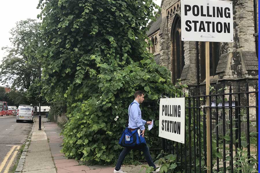 Exit polls show May's Conservatives could lose majority