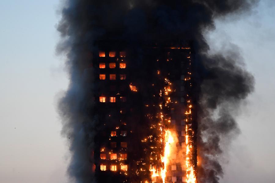 Fire engulfs London tower block, at least 12 dead