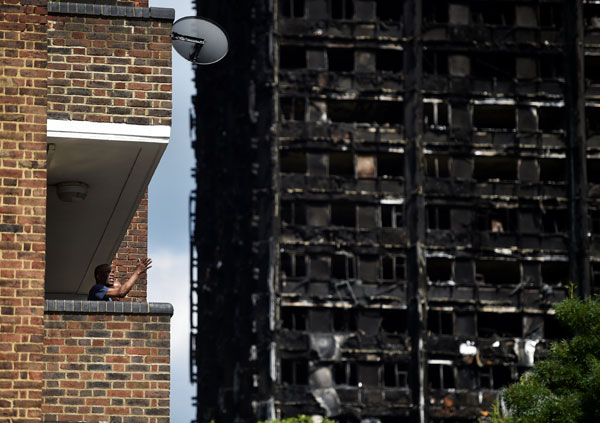 UK government scrambles to limit fallout from London fire