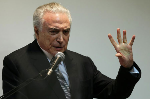 Temer vows to unite Brazil as Lula's supporters set to march