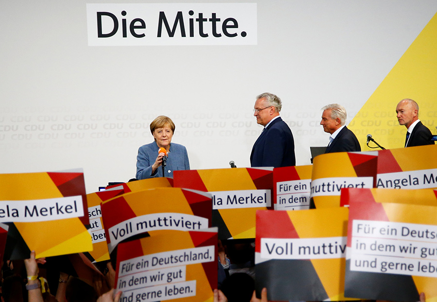 Merkel wins 4th term but nationalists surge in German vote