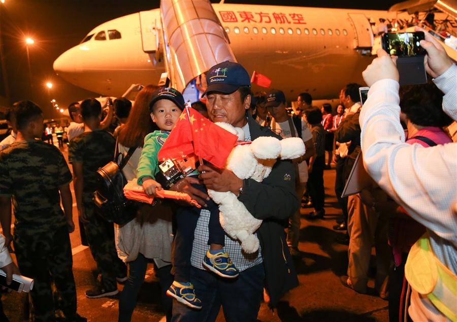 Chinese head home after hurricane