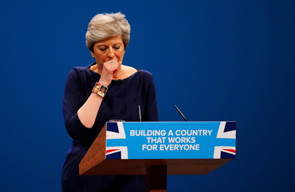 Ice maiden or robot? UK PM relives her disaster conference