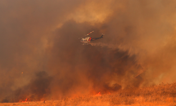 1 killed, 20,000 evacuated by wildfires in Northern California