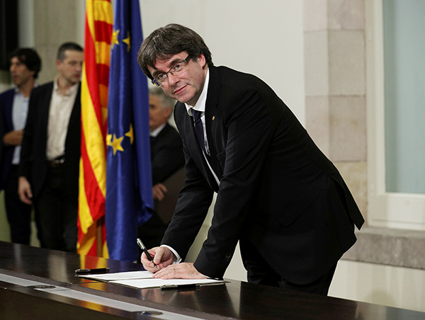 Catalan leader signs document declaring independence from Spain