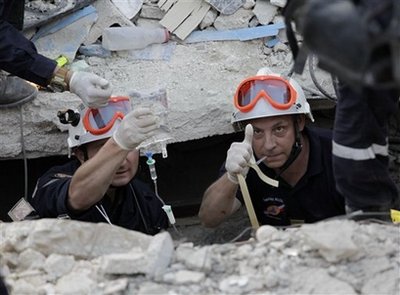 French rescuers pull girl from quake debris