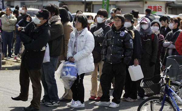 Residents queue for supplies after quake in Japan