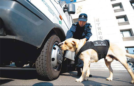 Dogs put bark in National Day security
