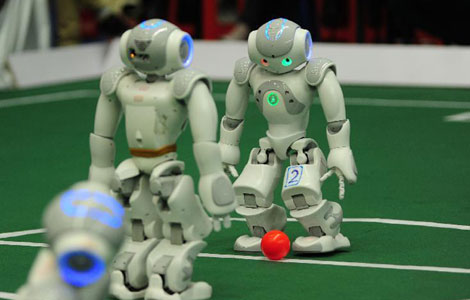 Robots kick off soccer match in E China