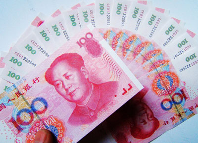 China widens yuan trading band