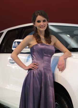 Model poses near a car by BAIC