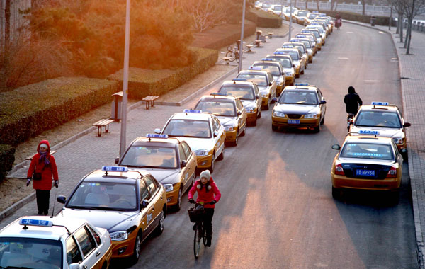Beijing cabbies fear loss of business
