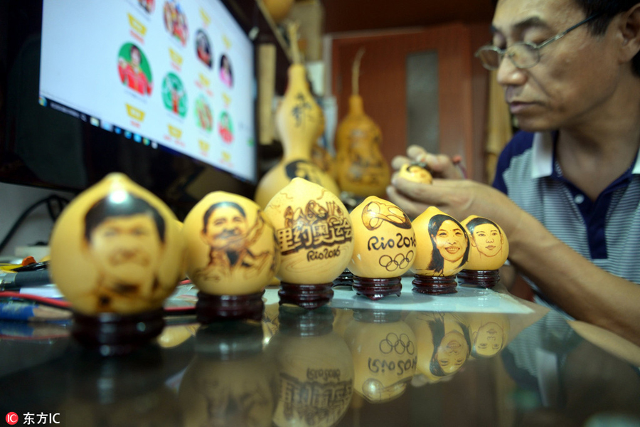Pyrographs of China's Rio Olympics champions on gourds