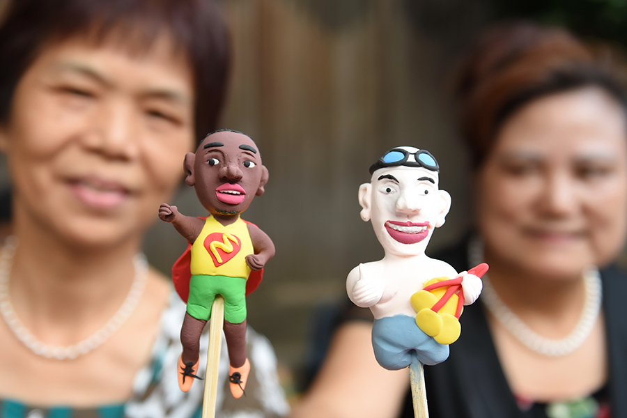 Dough figurine artists create mini Olympic stars