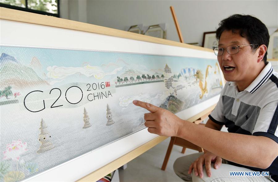 Local residents make silk scroll to greet G20 summit