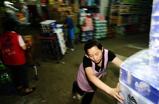 People stock goods for fear of heavy rain