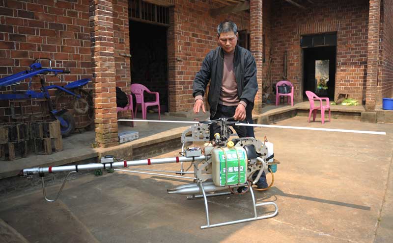 Farmer builds own drones to spray crops
