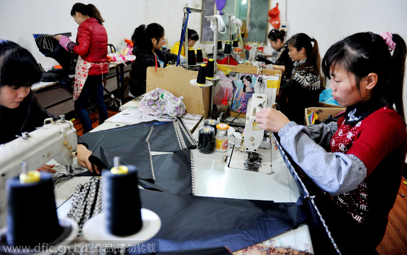 Women make umbrellas for export in Jiangxi