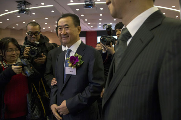 Wanda falls below offering price in HK debut