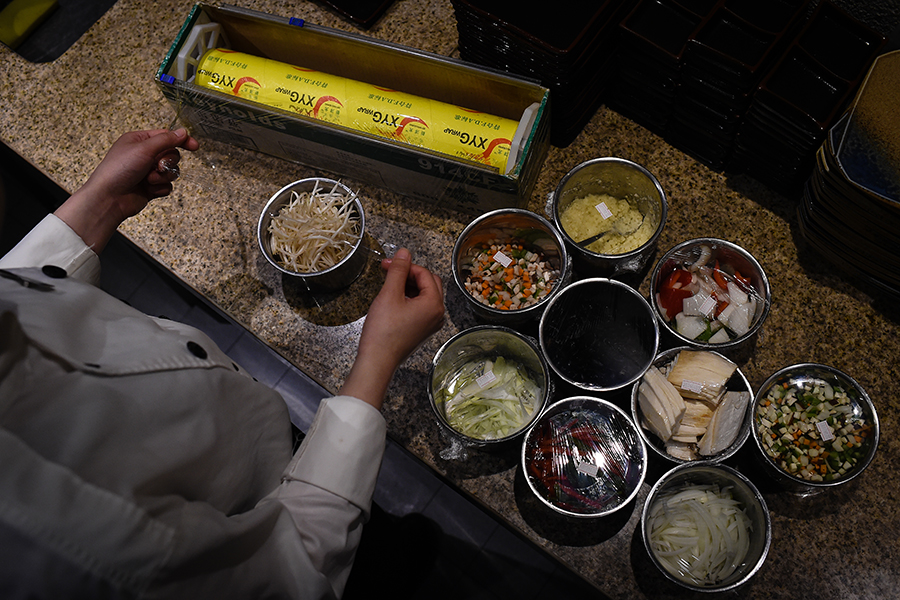 Young female chef performs for five-star hotel guests