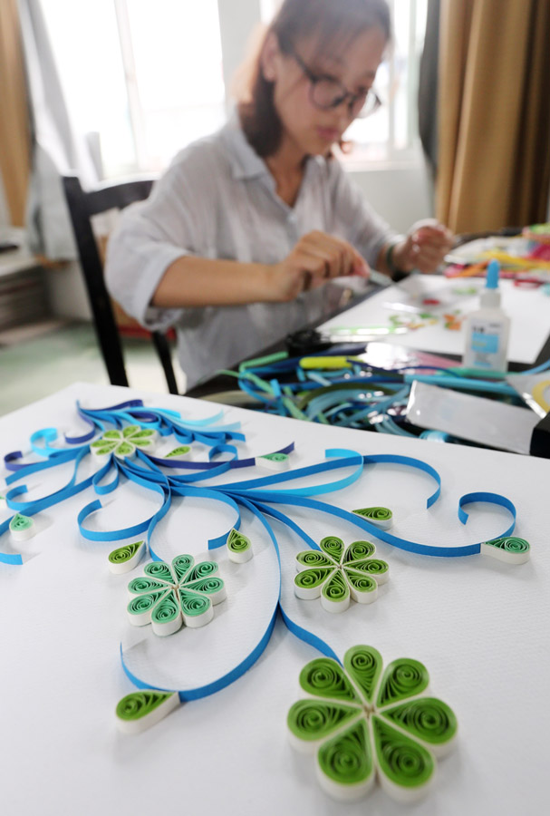 Labor of love: Graduate creates exquisite artwork with paper-rolling