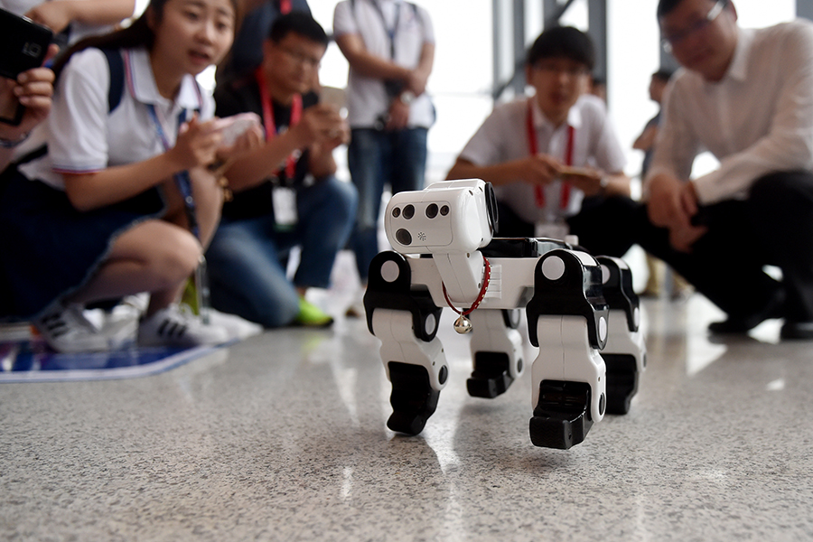 Hugging, calligraphy writing robots featured in Yuyao