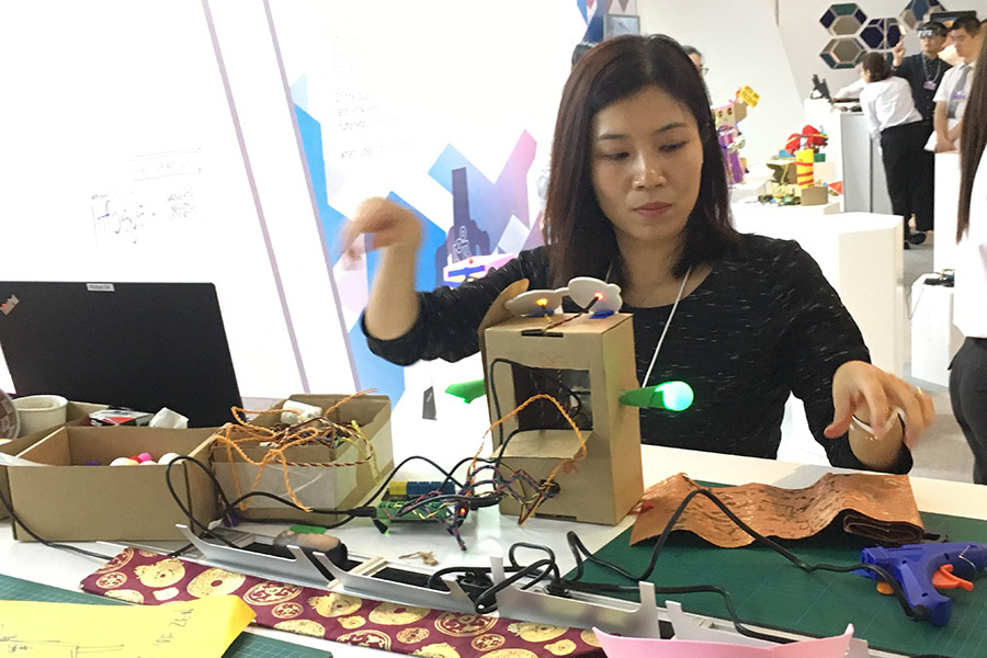 Participants try their hands on making robots at Summer Davos