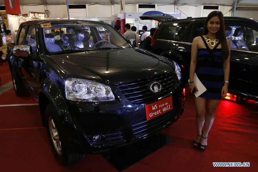 Cars, models at 10th Manila Intl Auto Show