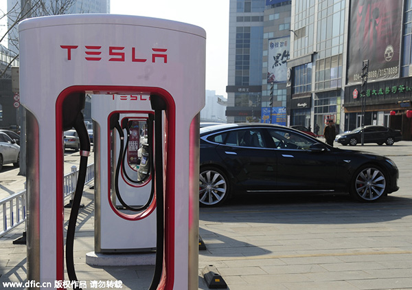 Tesla teams with property developer to expand charging poles
