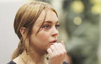 Lindsay Lohan says she's an addict, aims 'to shut up and listen'