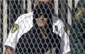 Handout shows Justin Bieber in police custody