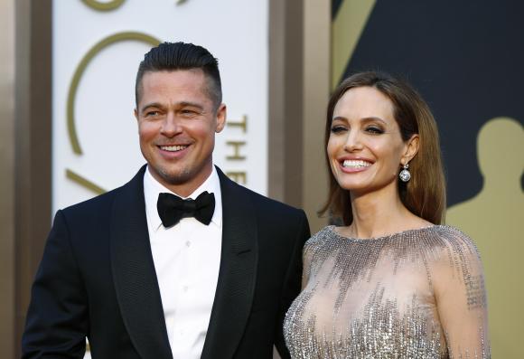 Quietly, Brad Pitt and Angelina Jolie say, 'I do'