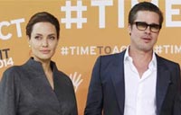 Quietly, Brad Pitt and Angelina Jolie say, 'I do'