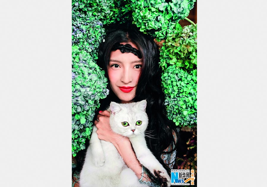 Pan Chen poses for <EM>Cat Fans</EM> magazine