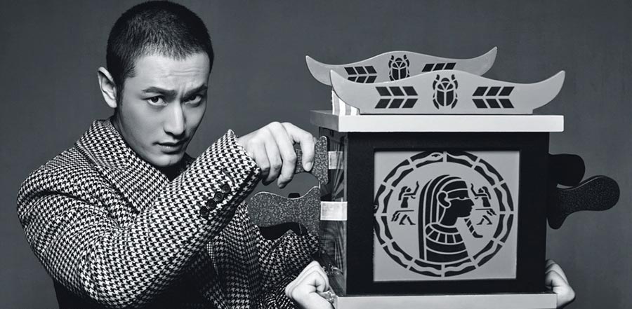 Newly-wed Huang Xiaoming poses for L'Officiel Hommes