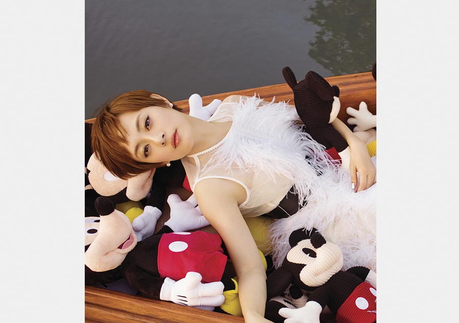 Ambassador for Disney Shanghai Sun Li poses in theme park